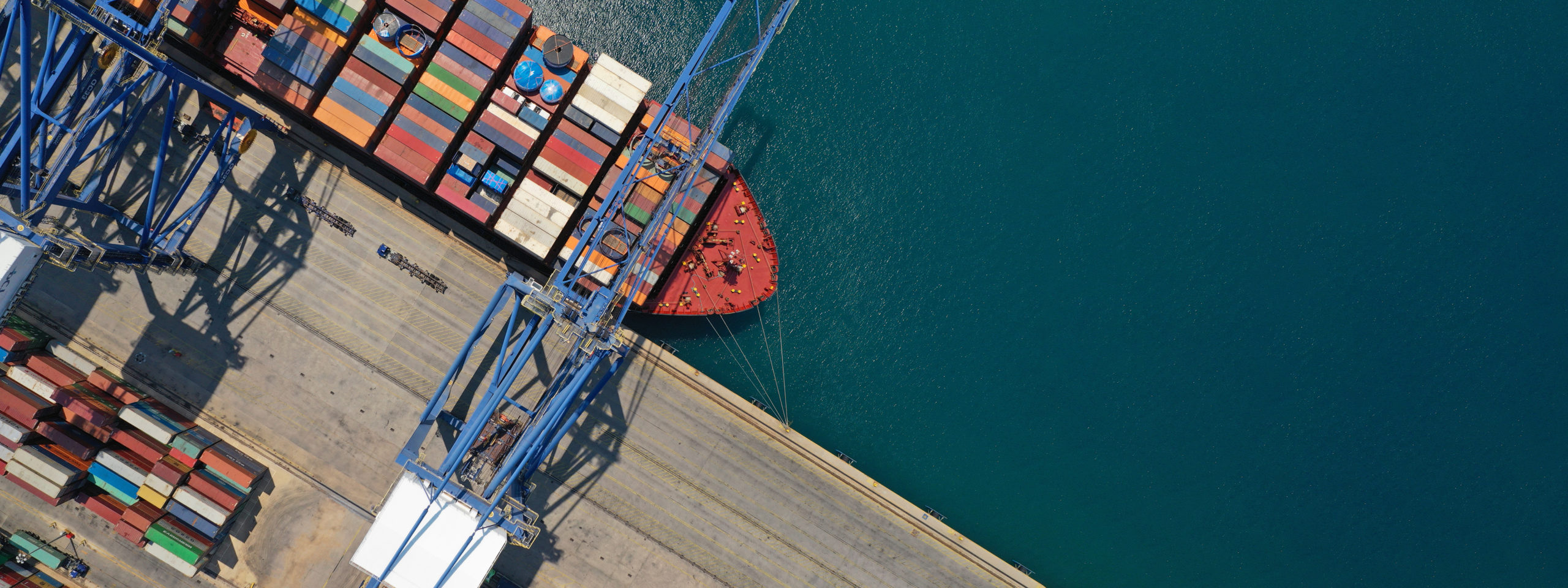 Aerial top down ultra wide photo of industrial cargo container s